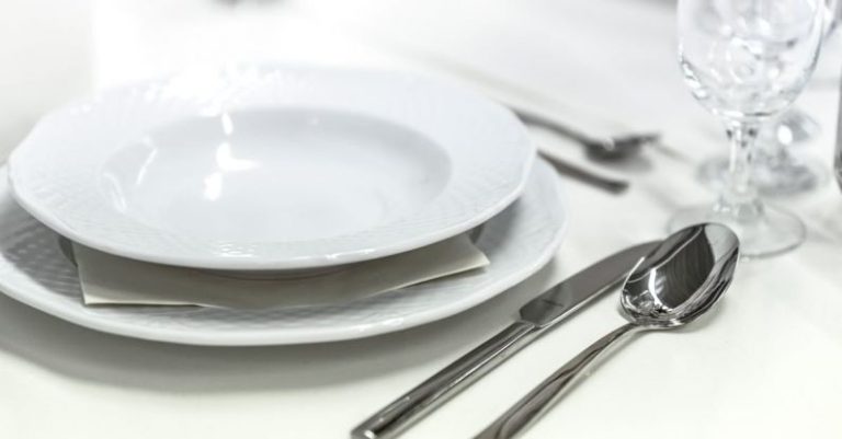 Table Setting - Round White Ceramic Bowl Placed on Table Beside Wine Glass