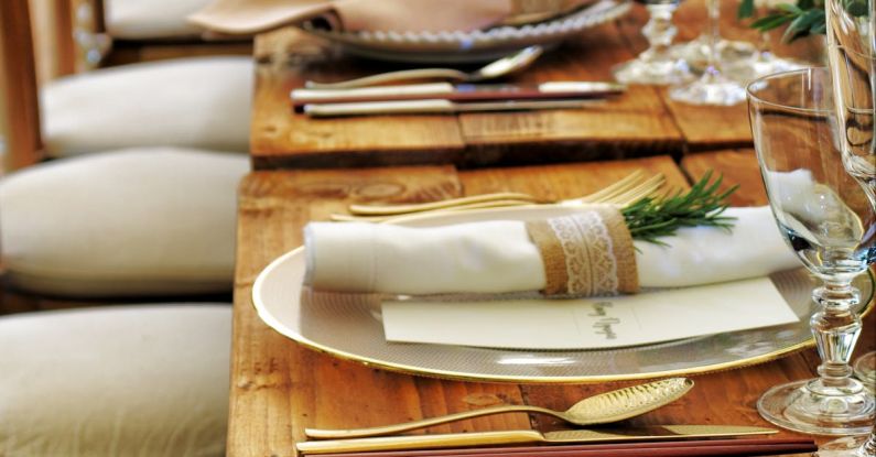 Dinner - Close-up Photo of Dinnerware Set on Top of Table With Glass Cups