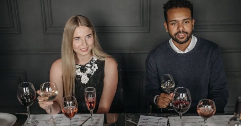 Tasting Menu - Man and Woman Holding Wine Glasses