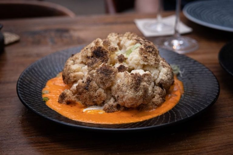 Steakhouses - brown and white food on blue ceramic plate