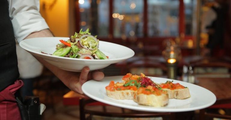 Dining - Person Holding Pastry Dishes on White Ceramic Plates