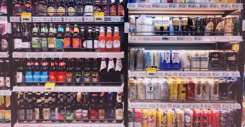 Beverages - Assorted Bottles and Cans in Commercial Coolers