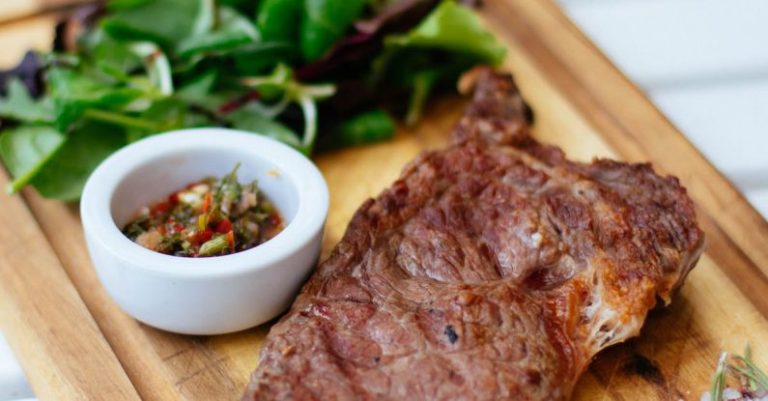 Steak - Shallow Focus Photography of Meat Dish and Leaves